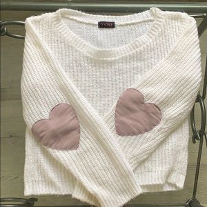 White sweater with purple hearts in the elbows